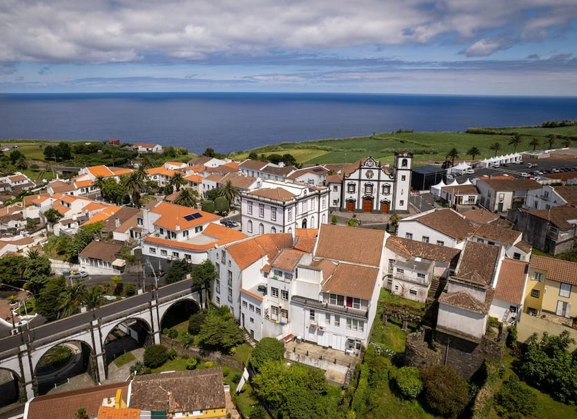 The Lince Nordeste in Nordeste with hillside village rooftops, viaduct, and ocean views