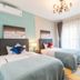 Live Inn Zhujiang New Town Branch in Guangzhou: twin beds, balcony doors and city-view curtains