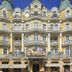 Orea Spa Hotel Bohemia in Mariánské Lázně, ornate yellow historic hotel facade with balconies and flags