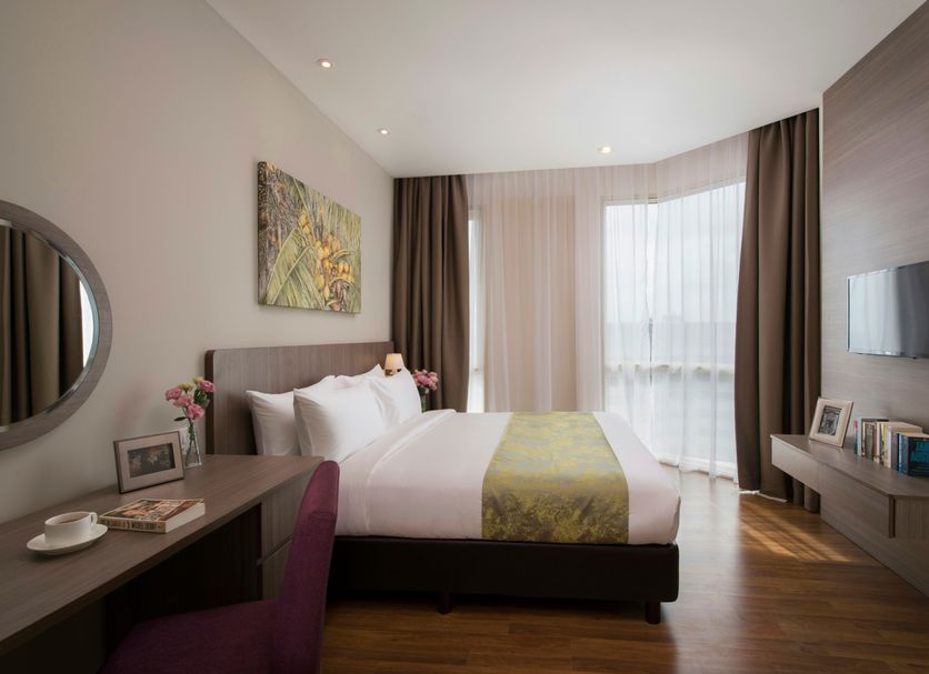 Somerset Medini Iskandar Puteri bedroom with floor-to-ceiling window and city view in Gelang Patah