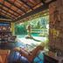 Casa Nostra Boutique Hotel in Paraty patio lounge with pool view and tropical garden