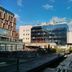 Hotel Art in Sarajevo exterior with glass façade, rooftop equipment, and a snowy courtyard