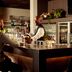 Van Der Valk Hotel Ara bar with bartender serving guests in Zwijndrecht