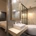 Hotel De Ciel Seoul bathroom with freestanding tub, vessel sink, and view into the bedroom