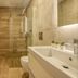 Kaliviani Traditional Hotel in Kissamos bathroom with walk-in shower, vanity sink, and toilet