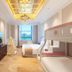 Grand Metropark Guofeng Hotel Tangshan room with bunk bed, twin bed, chandelier and city view in Tangshan
