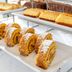 Pousada Viana do Castelo buffet with powdered sugar cake rolls and sliced loaf cakes in Viana do Castelo