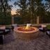 Courtyard by Marriott Charleston Downtown/Civic Center fire pit seating area with brick patio at dusk