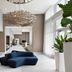 Courtyard by Marriott Delray Beach lobby with modern seating, tall plants and a sculptural chandelier in Coral Springs