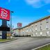 Red Roof Inn Etowah - Athens, TN exterior with sign and multi-story hotel building in Etowah