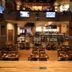 Four Winds Casino Resort in New Buffalo interior with bar seating, TVs, and dining tables