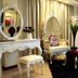 Golden Phoenix Hotel Boracay lounge in Boracay with ornate chairs, vanity table and black rug