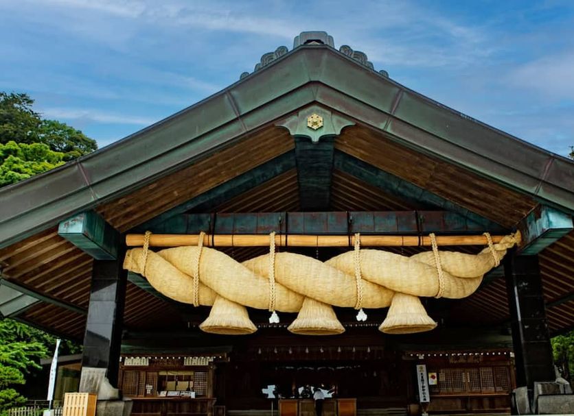 Toyoko Inn Izumo-shi Ekimae in Izumo with a traditional wooden entrance and decorative hanging straw ornaments