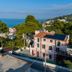 Park Hotel Villa Maria in Vico del Gargano with sea view, hillside greenery, and a pink villa exterior
