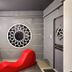 Astrotel Cubao in Quezon City room with red lounge chair and circular wall art