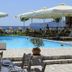Castello Antico Hotel in Gytheio with outdoor pool, sun loungers, umbrellas, and sea views