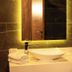 Yildiz Life Hotel in Trabzon bathroom vanity with vessel sink, mirror, towels and wall-mounted hair dryer