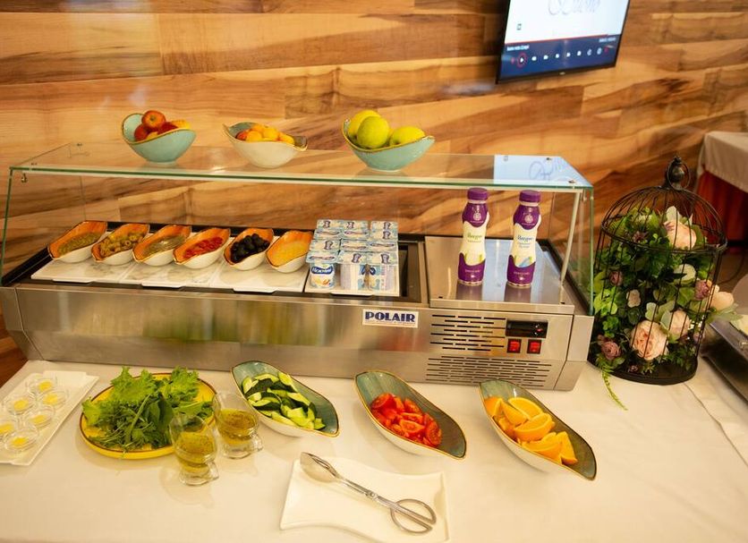 B Hotel Bishkek buffet counter with pastries, fruit, salads and drinks in Bishkek
