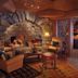 Lake Placid Lodge in Lake Placid, stone fireplace lounge with leather chairs and warm wood interior