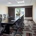 Four Points by Sheraton Buffalo Grove meeting room with long conference table and mesh chairs