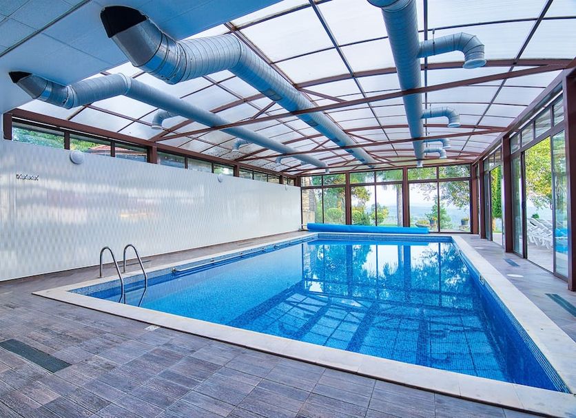 Park Hotel Arbanassi indoor pool in Arbanasi with glass enclosure and skylit ceiling