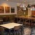 Fairfield Inn & Suites by Marriott Lewisburg breakfast area with tables, stools, and pendant lights