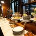 Breakfast buffet at Marine Beach Hotel Pattaya in Jomtien with pastries, cakes and stacked plates