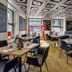 Cascada Boutique Hotel, Lucerne: modern restaurant dining area with tables, chairs, and large windows