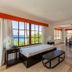Sosua By The Sea room with ocean view, twin beds, and dining area in Sosúa