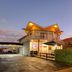 Countryman Motor Inn in Dubbo exterior at dusk with illuminated sign and covered entrance