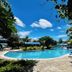 EGI Resort and Hotel in Lapu-Lapu City with outdoor pool, lounge chairs, and tropical garden views