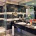 Melia Habana, Havana bathroom with double vanity, large mirror, and glass-enclosed shower