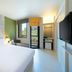 ibis Styles Krabi Ao Nang hotel room with balcony, large bed, and window view in Krabi