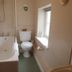Manor Farm B&B bathroom in Marlborough with bathtub, toilet and window seat
