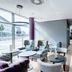 Premier Inn Lübeck City Centre lobby with seating area and large street-facing windows in Lübeck