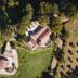 Aerial view of Agriturismo La Meria in Semproniano surrounded by trees and fields