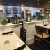 The Cove at Yarmouth by Westgate Resorts dining area in West Yarmouth with tables and lantern decor