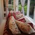 Volcano Acres Ranch B&B in Volcano, sunroom seating with floral cushions and garden views