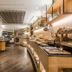 Electra Palace Thessaloniki buffet dining area with wooden counters and bread display in Thessaloniki