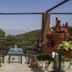 Nagarkot Bed & Breakfast terrace with potted flowers and mountain views in Nagarkot