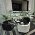 Hotel Vijay Parkinn, Coimbatore dining area with glass display counter and modern tables