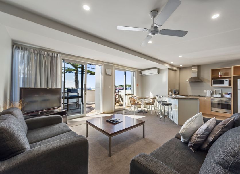 Pavilion Beachfront Apartments in Mount Maunganui living area with balcony and sea view