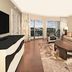 Hilton Grand Vacations Club Parc Soleil Orlando living room with balcony and pool view