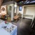 Hotel Vai Moana in Hanga Roa guest room with double bed, ensuite bath, bench, and desk area