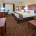 Grand Forks Lodge and Suites in Grand Forks: guest room with two beds, sofa, desk, and chair