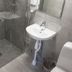 Bathroom at Hotel Aveny Bed & Breakfast in Gävle with shower, sink and toilet