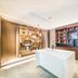 Home Inn Plus Foshan Shunde Qinghui Garden Rt-Mart lobby with white island counter and beverage shelves in Foshan