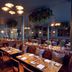Hotel du Vin Henley dining room in Henley-on-Thames with set tables, tufted banquettes and warm lighting