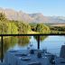 Asara Wine Estate & Hotel, Stellenbosch: terrace dining with mountain and pond views
