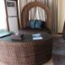 Golden Phoenix Hotel Boracay lounge with wicker daybed, round table and woven chairs in Boracay